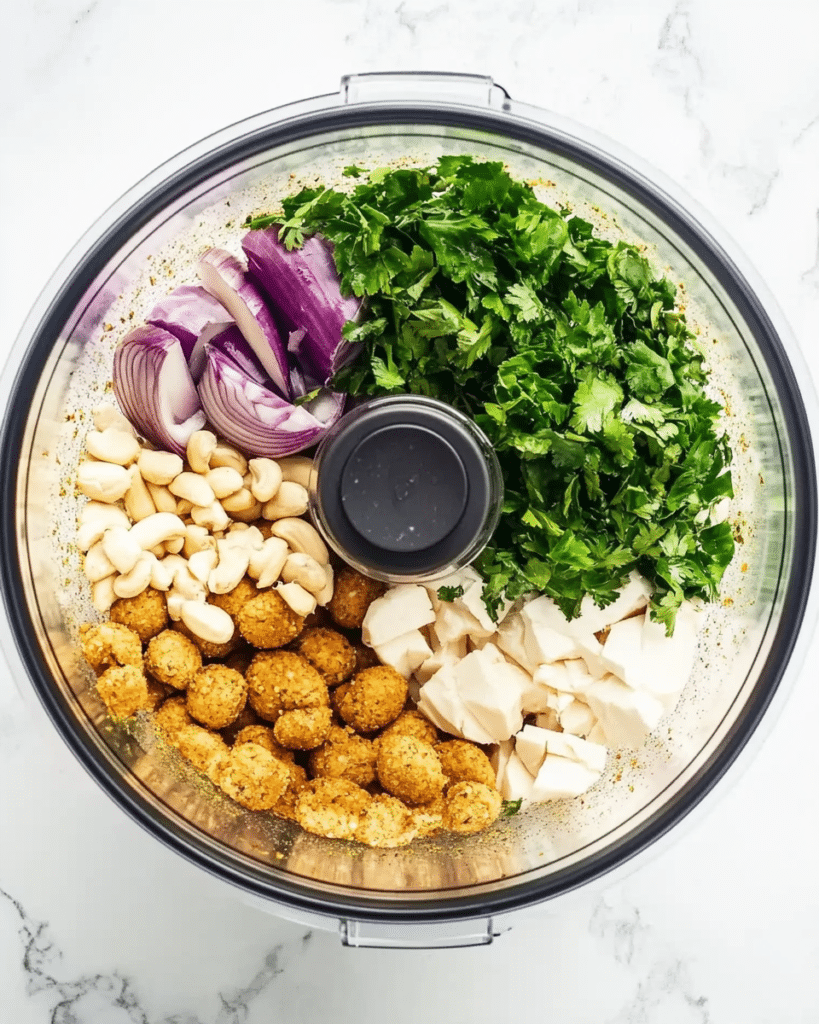 Authentic Falafel: Discover the Perfect Recipe Today! 15 a food processor containing the ingredients for homemade falafel